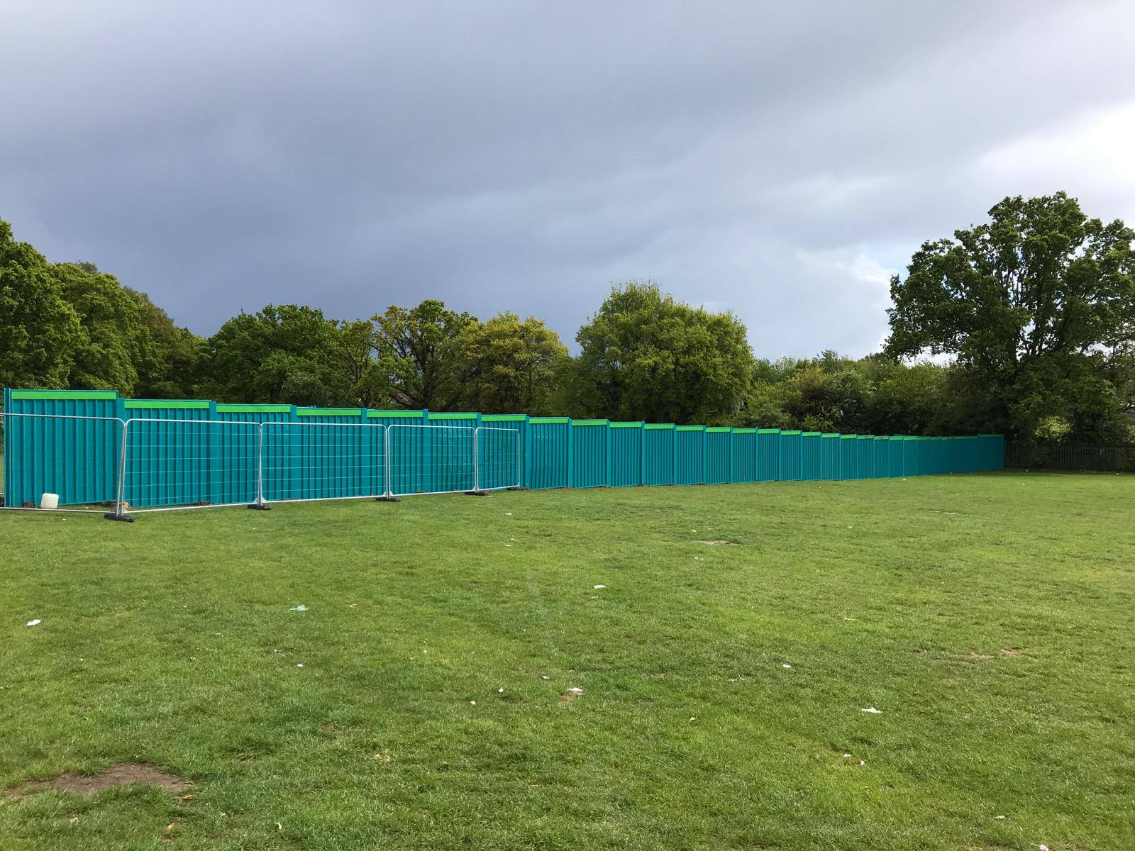 Example installation of On-Ground Steel Hoarding in Aqua Blue